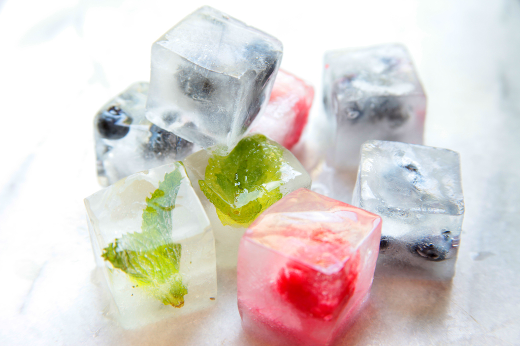 Berries and mint in ice cubes
